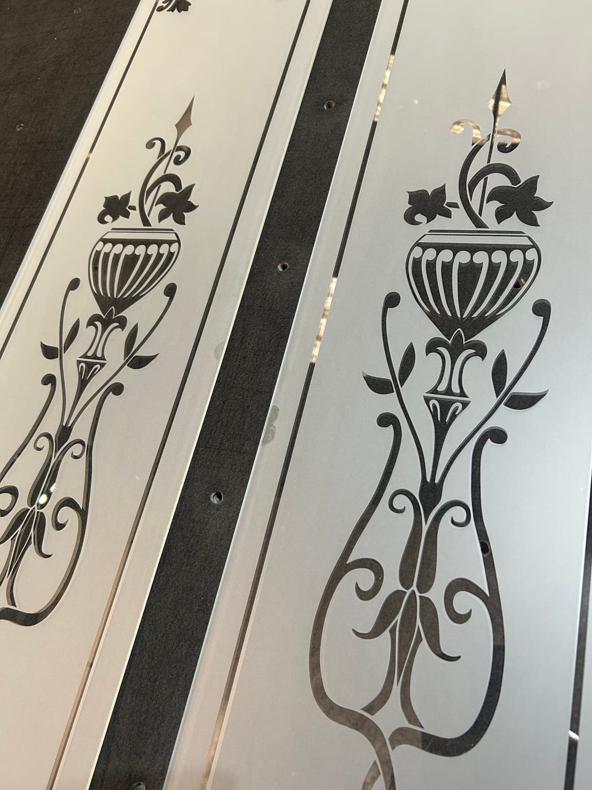 Two coordinated panels with classical urn designs and floral scrollwork