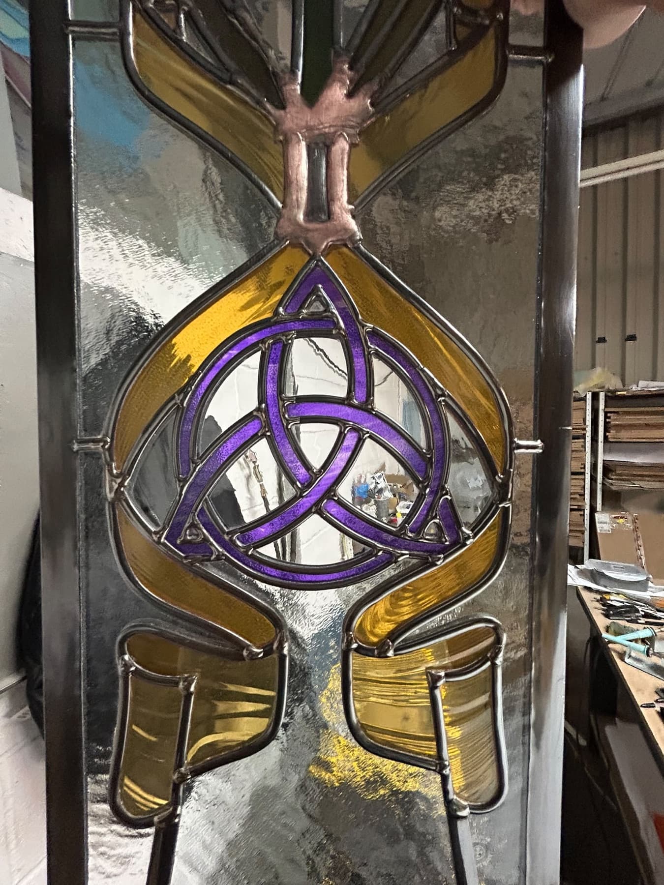 Purple Celtic knot on clear textured glass with amber ribbons