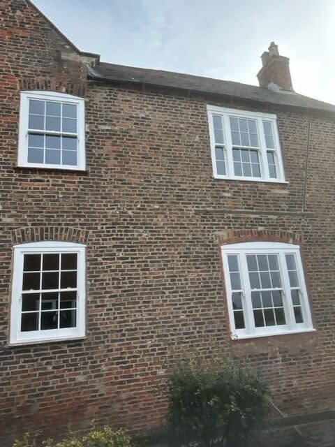 A brick period house with slimline double-glazed sash windows